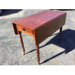 A Victorian mahogany drop-leaf table, having cockbeaded knobbed frieze drawer, raised on turned legs