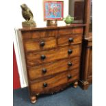 A Victorian mahogany chest of drawers, the rectangular top above two short and three long knobbed