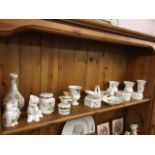 A collection of Wedgwood Wild Strawberry pattern pieces - vases, trinket pots & covers, a bell,