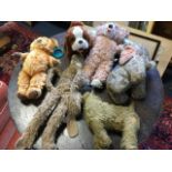 A collection of plush soft toys - an early dog with glass eyes and stitched snout, a pull-a-long