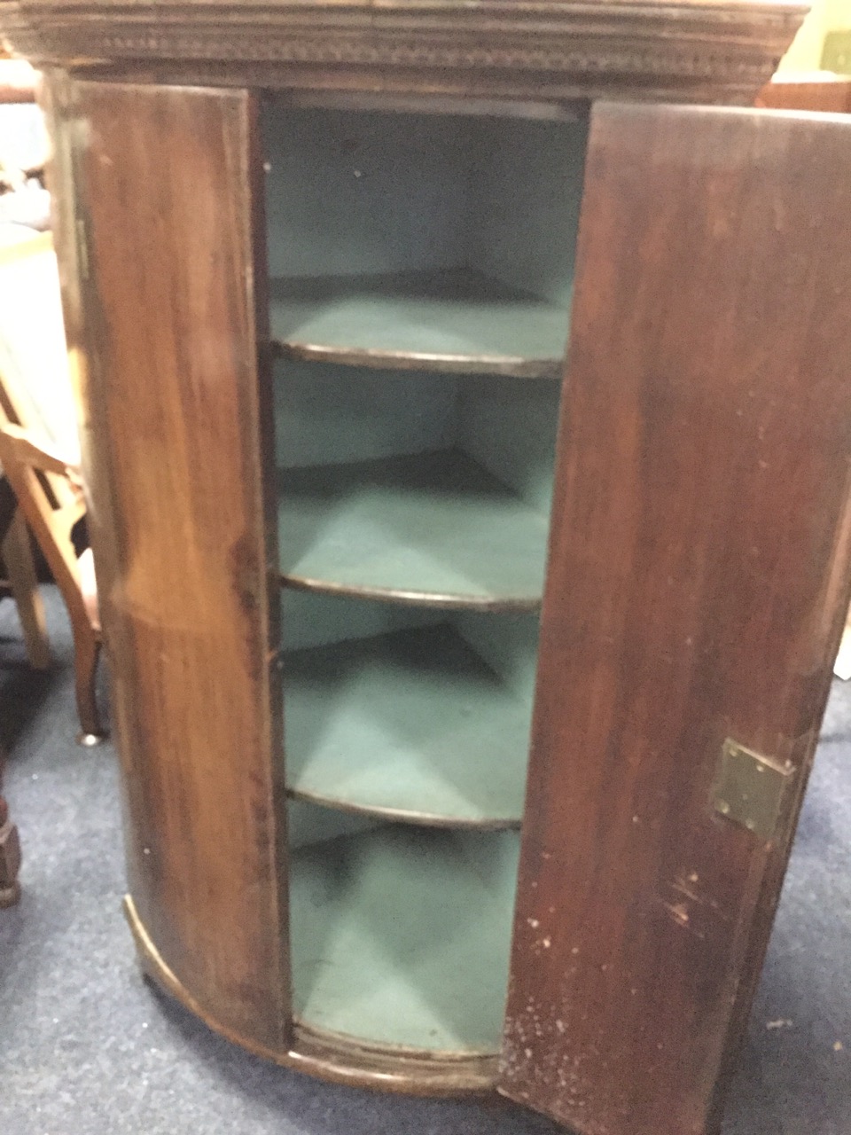 A barrel fronted nineteenth century mahogany corner cabinet with moulded dentil cornice above two - Image 3 of 3