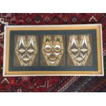 African school, singed wood and paint on board, three stylised geometric masks, signed