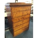 A nineteenth century European mahogany chest of drawers, the rectangular top with crescent plinth on