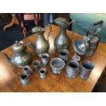 Miscellaneous pewter including jugs, a teapot, ancient measures, an egg cup, tankards, etc; and a