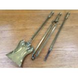 A set of three Edwardian brass fire irons with square shafts and handles with ball terminals -