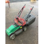 A Qualcast electric mower with grassbox and folding handle.