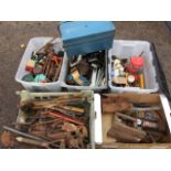 Miscellaneous tools including materials, brackets, saws, hammers, gutter pieces, a tyre pump, two