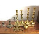 Two pairs of Victorian brass candlesticks with ejector rods; a pair of miniature brass fenders; a