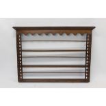 Georgian oak plate rack with pendant frieze and open shelves between pierced sides 138cm wide x