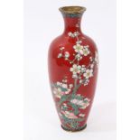 Late 19th Century Japanese cloisonné oviform vase decorated with polychrome blossoming tree on red