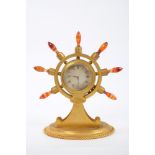 Good quality Victorian novelty ormolu case mantel timepiece in the form of a ships wheel with