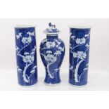 Garniture of three early 20th century Chinese blue and white vases comprising pair cylinder vases