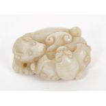 Chinese pale jade carving in the form of a mythical beast, breathing fire,