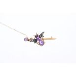 Edwardian novelty insect brooch in the form of a bee with amethyst body and seed pearl wings,