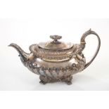 Early George IV silver teapot of compressed baluster form, with fluted and ball decoration,