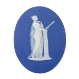19th century Wedgwood blue jasper ware oval plaque decorated in relief with classical maiden
