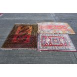 Eastern rug having three serrated medallions on brick red ground in multiple borders, 84 x 113cm,