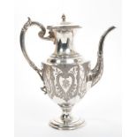 Late Victorian silver coffee pot of hexagonal baluster form, with Gothic-style engraved decoration,