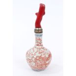 Chinese porcelain snuff bottle with blue and red dragon decoration and coral stopper,