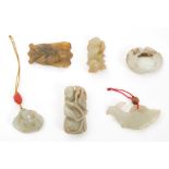 Group of Chinese jade or hardstone carvings including a russet jade pendant modelled as a cicada,