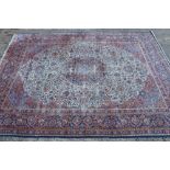 Good antique Kashan carpet with central foliate medallion issuing scrolling lotus flowers on cream