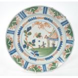 18th century Delft polychrome charger painted with iron red,