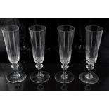 Set of ten champagne flutes with cut bowls and knopped stems,
