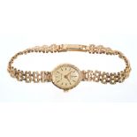 Ladies' Boodles gold quartz wristwatch with oval dial on 9ct gold gate-link bracelet. Length 17.