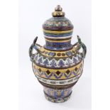 Southern European glazed pottery urn and cover with lizard handles,