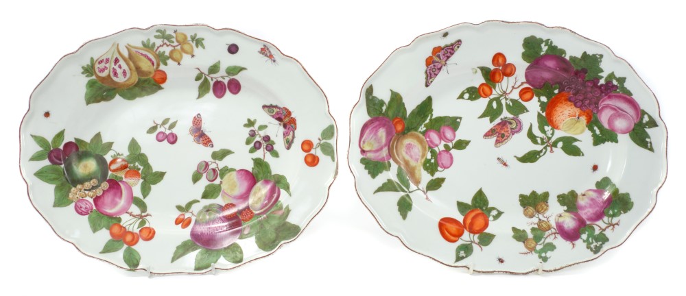 Pair of mid-18th century Chelsea silver-shape meat plates with polychrome painted fruit and insect