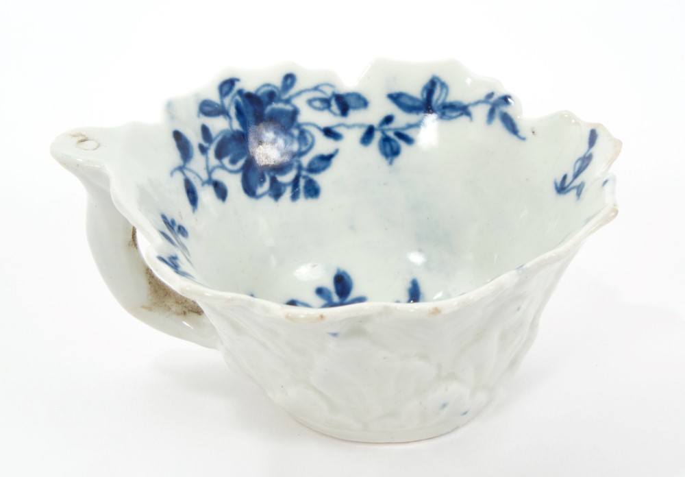 18th century Worcester blue and white leaf-moulded butterboat with floral decoration and stalk