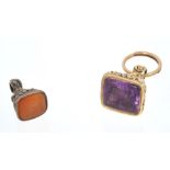 Regency yellow metal seal with amethyst glass intaglio armorial crest and one other (2)