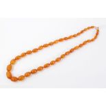 Old amber bead necklace with a string of graduated butterscotch amber beads measuring approximately