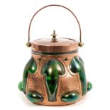 Fine late 19th century Art Nouveau Loetz-style iridescent glass and beaten copper biscuit barrel