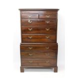 George III mahogany chest on chest, the upper section with canted angles and dentil cornice,