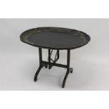 Unusual 19th century black papier mâché tray on collapsible integral stand,