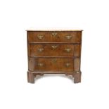 Early 19th century walnut bow front chest of drawers of small size, with three graduated drawers,