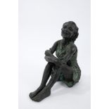 Bronze resin figure of a young girl in seated pose with verdigris finish, indistinctly signed RCC,
