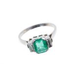 Art Deco-style emerald and diamond ring with an octagonal step cut emerald weighing approximately 1.