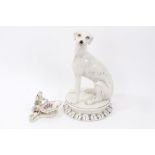 A German porcelain small sweetmeat figure, in Meissen style, painted with flowers, 5½" wide,