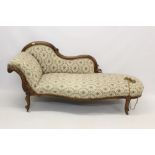 Victorian walnut chaise longue with leaf scroll carved show-wood frame and floral tapestry