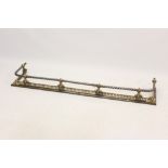 Victorian steel and brass mounted fender with mask angles,