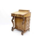 Victorian walnut serpentine fronted davenport desk with raised rear stationery compartment and