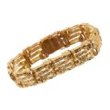18ct gold bracelet with articulated textured basket weave links.