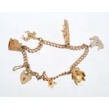 9ct gold charm bracelet with five gold charms and one silver charm CONDITION REPORT