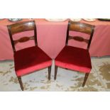 Set of six Regency bar back dining chairs each with claret red upholstery on turned legs