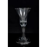 Early Georgian wine glass with trumpet bowl on bulbous stem with air bubble plain stem on folded
