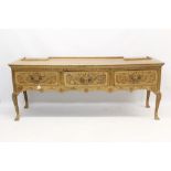 18th century and later blond oak dresser base with three scroll carved drawers raised on cabriole