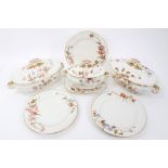 A Royal Worcester Vitreous part dinner service decorated with floral gilt borders,