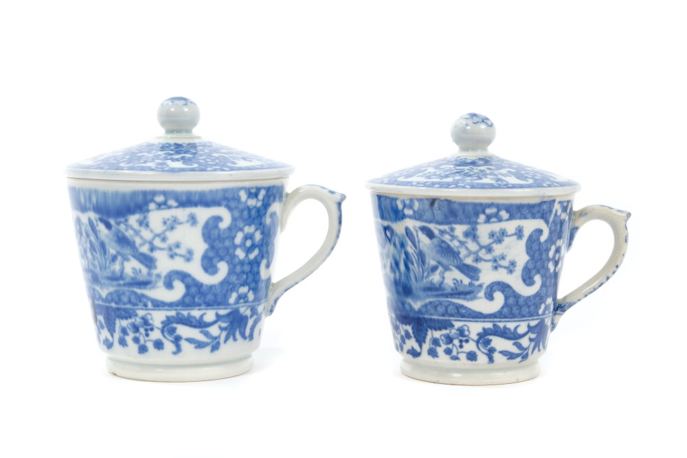 Two early 19th century pearlware custard cups and covers with printed bird and floral decoration